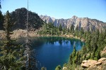 Lake Wiseman ringed by serpentine Twin Sisters Range
